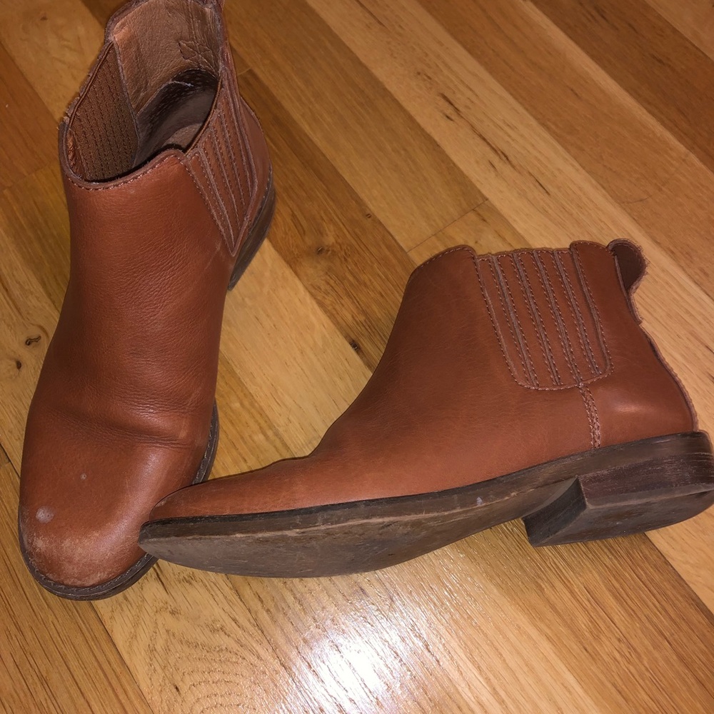 Worn brown leather boots by Madewell